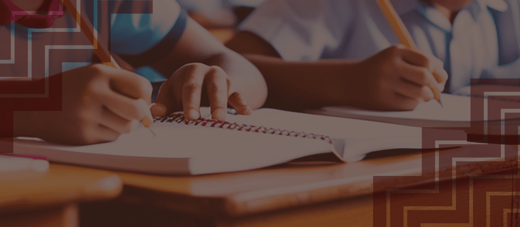 hands writing in notebook